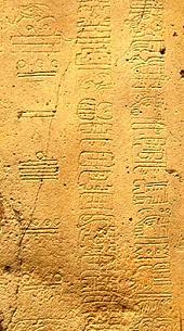 symbols of Long Count calendar date inscribed on maya artifact