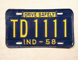 Antique Indiana license plate showing number 1111